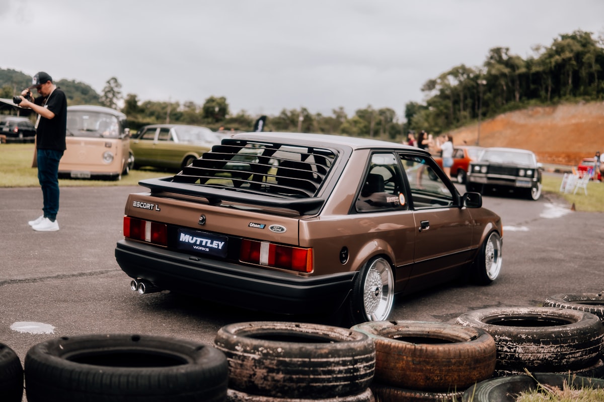 a brown car parked next to a pile of tires related to Upgrading Your MK4 Golf with a Front Valance