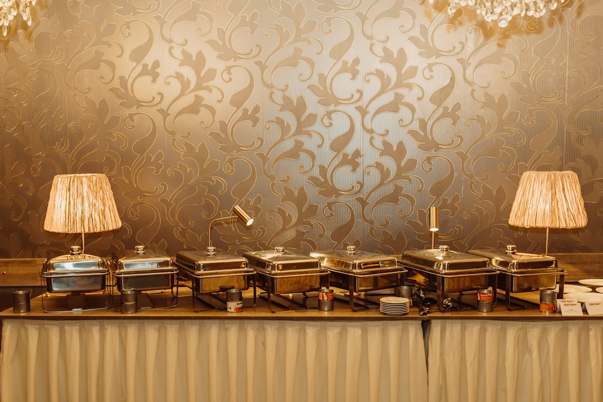 a buffet table topped with lots of food related to Elevating Your Dining Experience: The Art of Buffet & Sideboards