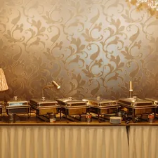 a buffet table topped with lots of food related to Elevating Your Dining Experience: The Art of Buffet & Sideboards
