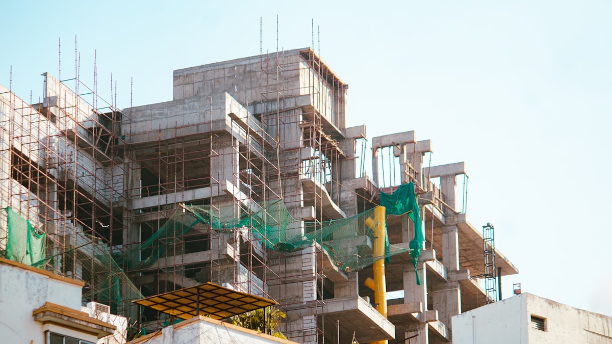A building is under construction with scaffolding. related to Building a Valance: A Comprehensive Guide