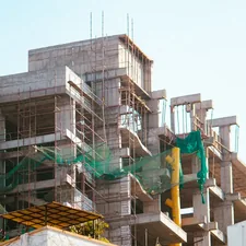A building is under construction with scaffolding. related to Building a Valance: A Comprehensive Guide