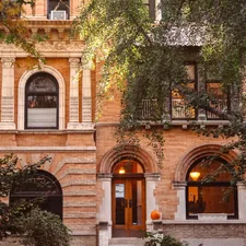 a building with a clock on the front of it related to Discover the Charm of Bed and Breakfasts in Brooklyn