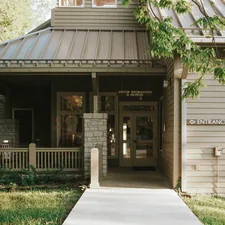 a building with a metal roof and a porch related to Exploring the Charm of Bed and Breakfasts in Tennessee