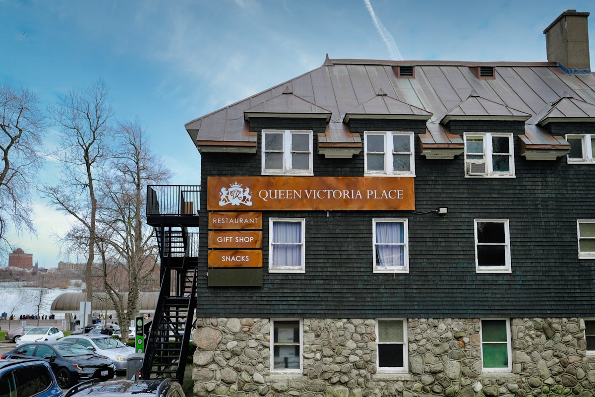 a building with a sign that says queen victoria place related to Charming Retreat at Queen Victoria Bed & Breakfast