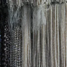 a bunch of beads hanging on a wall related to Beaded Waterfall Valance: Elevate Your Home Decor