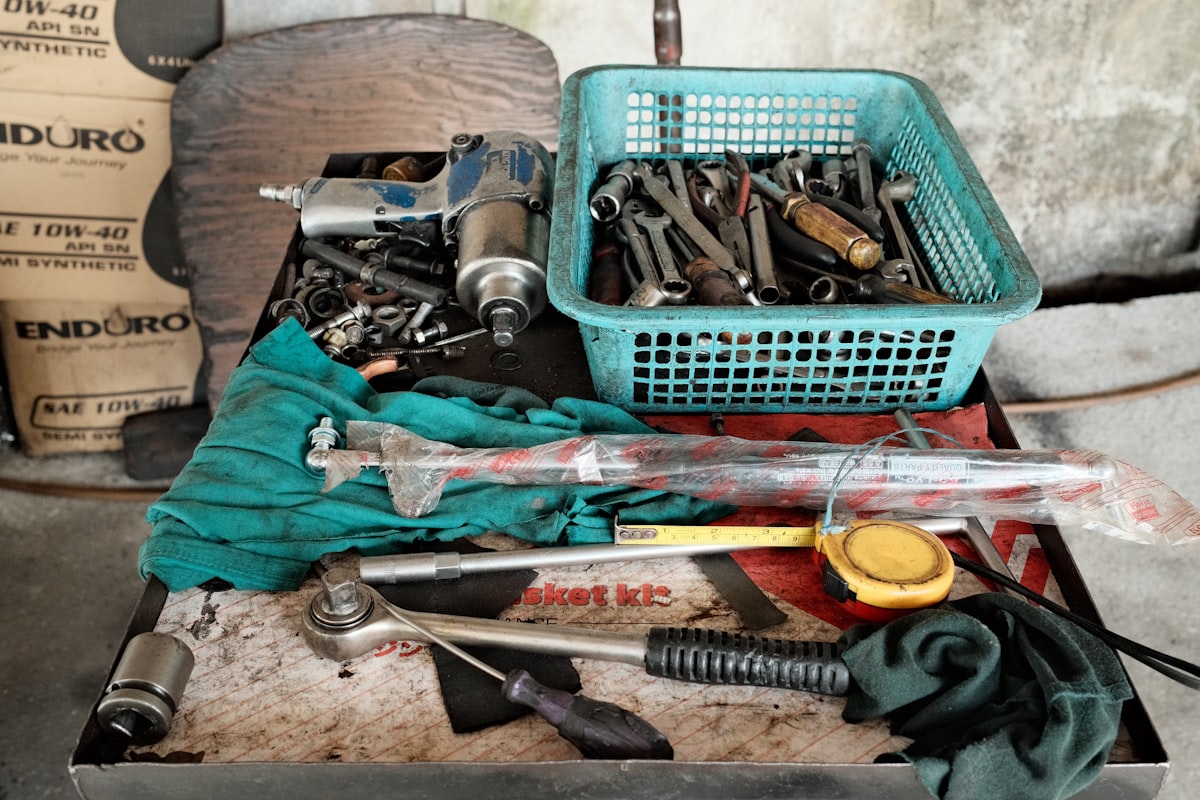 A bunch of tools that are sitting on a table related to In Bed Tool Box: The Ultimate Storage Solution for Your Bedroom