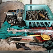 A bunch of tools that are sitting on a table related to In Bed Tool Box: The Ultimate Storage Solution for Your Bedroom