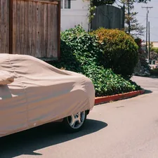 a cart with a white cover on it related to The Ultimate Protection: Choosing the Perfect Large Chiminea Cover