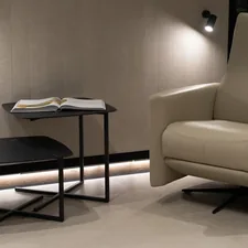 A chair and a table in a room related to The Ultimate Guide to Recliner Bed Chairs: Comfort and Functionality Combined