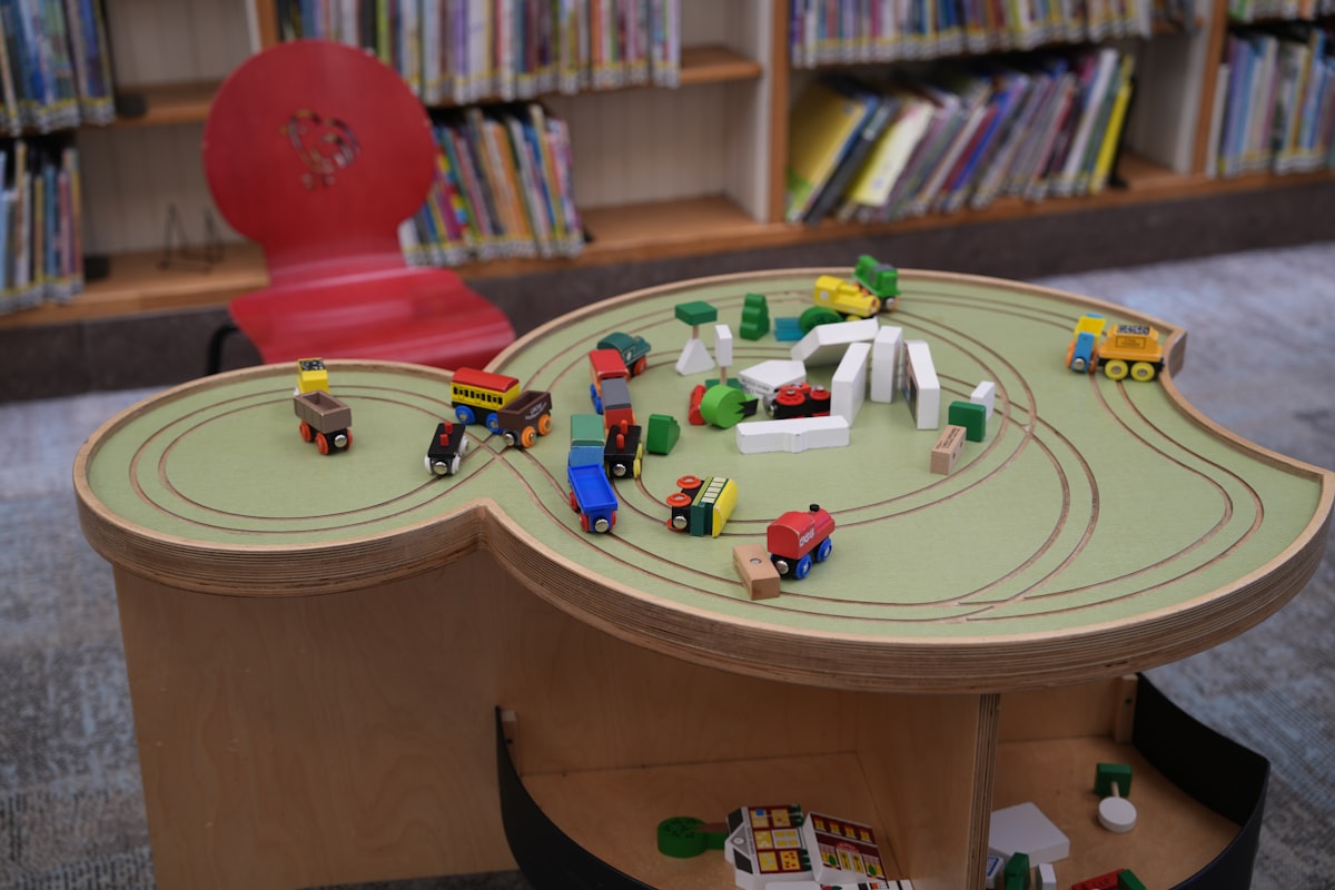 A child's table with a toy train set on it related to Maximizing Space with an Under Bed Train Table: The Ultimate Storage Solution