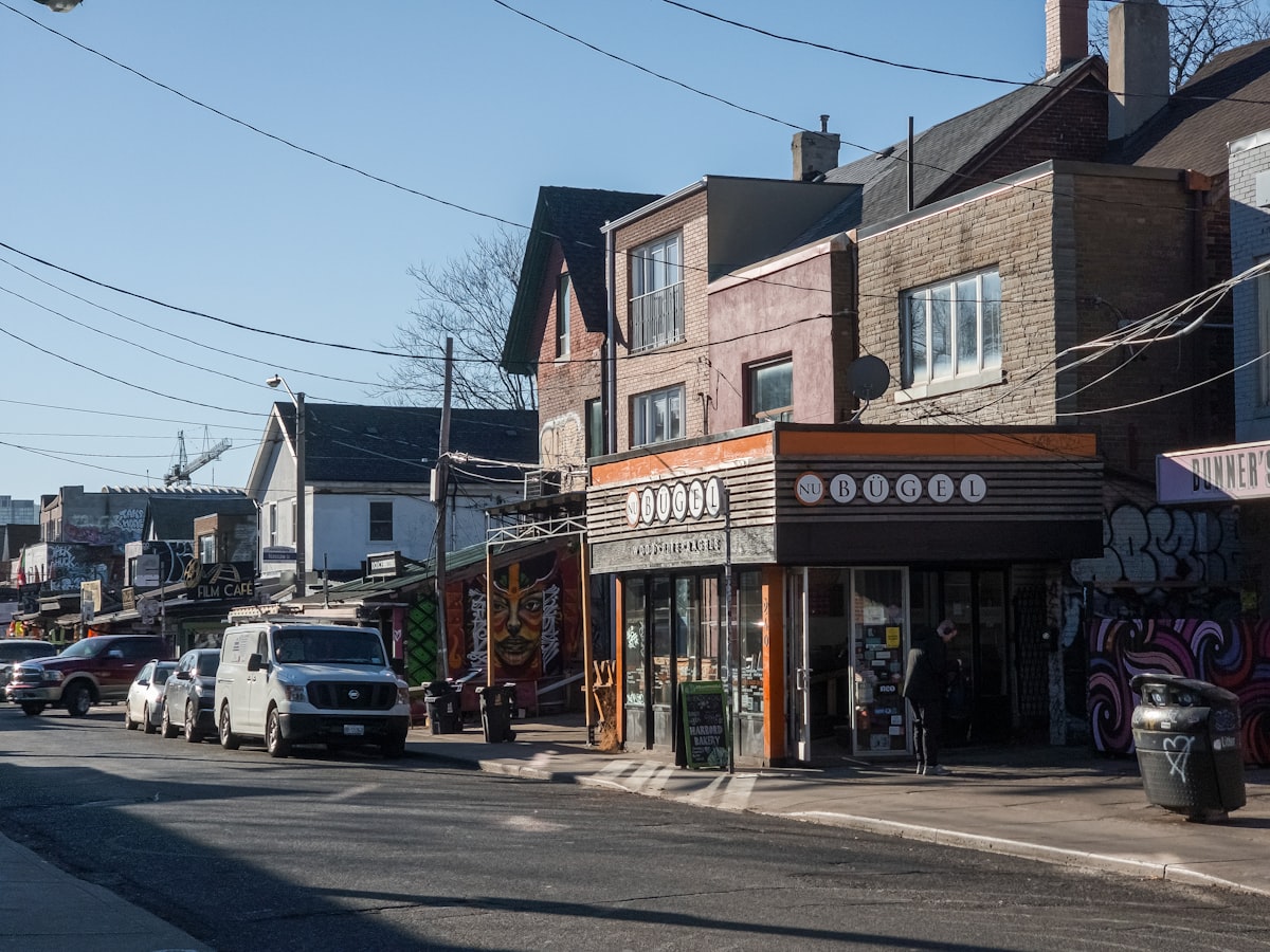 a city street with cars parked on the side of it related to Discovering the Charm of Bed and Breakfasts in Toronto