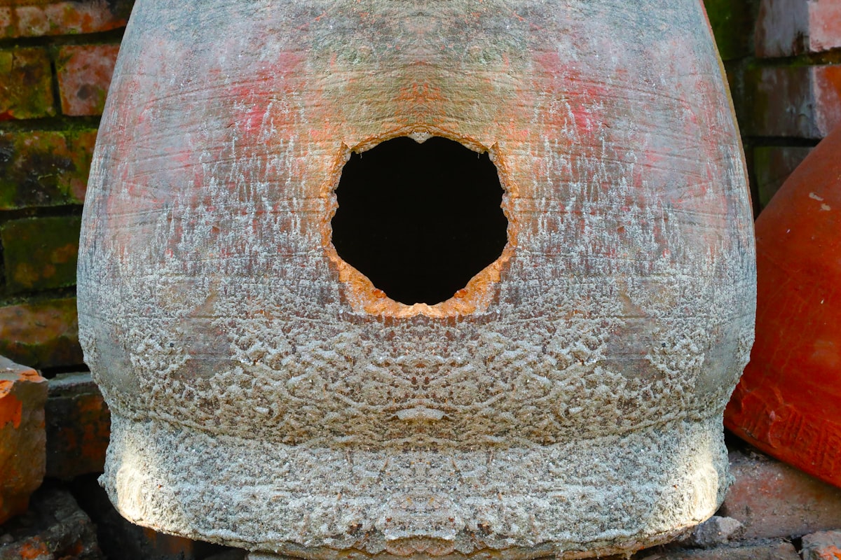 A close up of a bird house with a brick wall in the background related to The Ultimate Guide to the Best Clay Chimineas