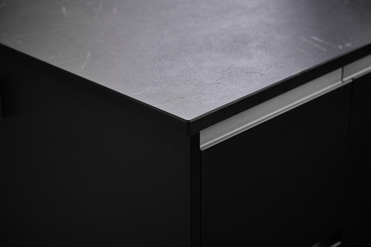 a close up of a black metal cabinet related to Black Sideboard Buffet Ideas