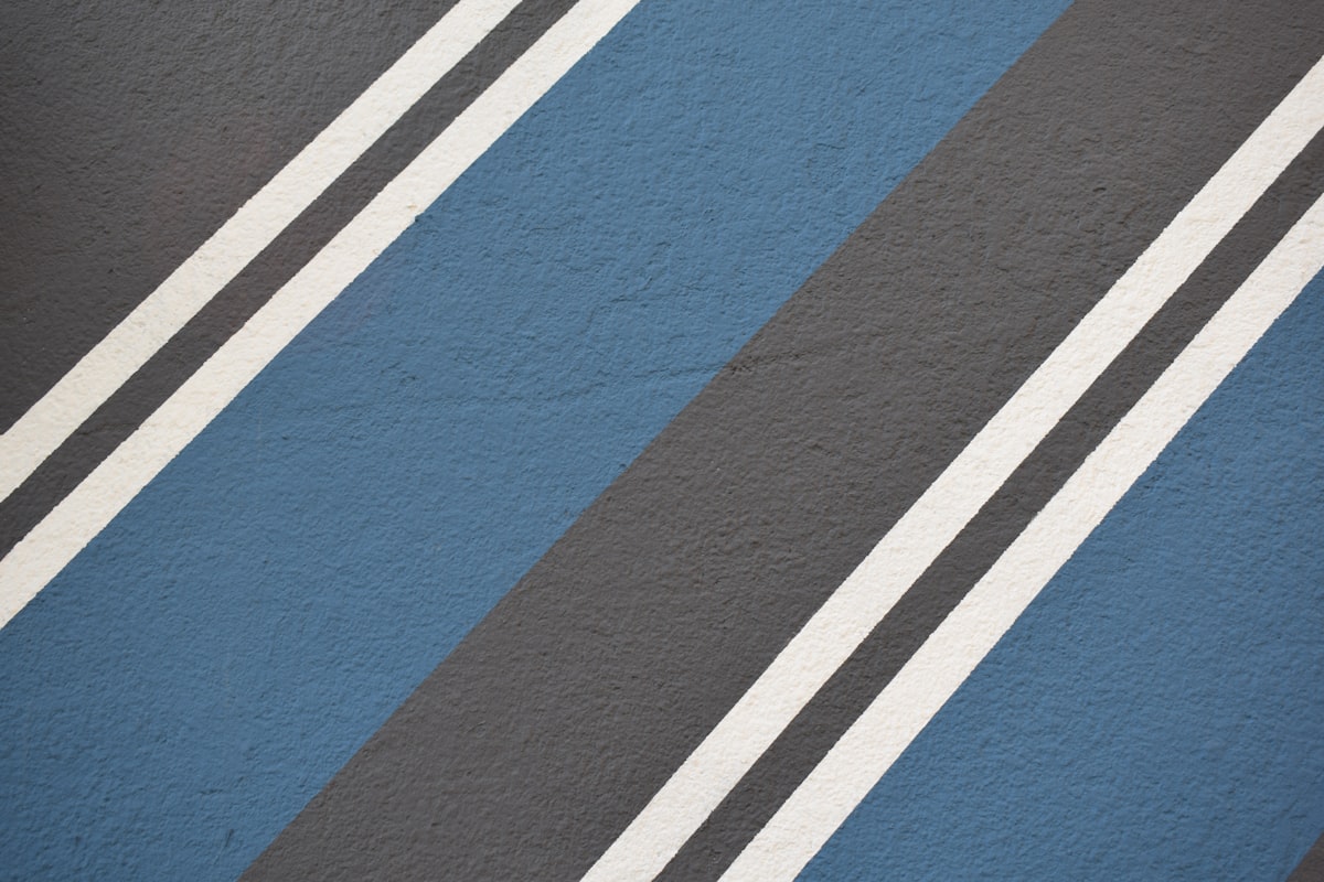 A close up of a blue and black striped wall related to Blue Stripe Valance Ideas to Elevate Your Decor