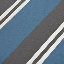 A close up of a blue and black striped wall related to Blue Stripe Valance Ideas to Elevate Your Decor