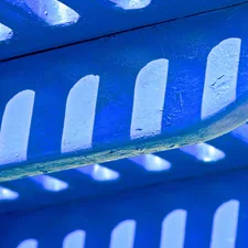 a close up of a blue and white bench related to Get a Golden Glow on a Budget: Used Tanning Beds for Sale