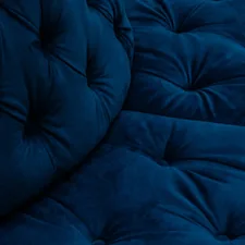 a close up of a blue couch cushion related to Velvet Coverlets and Quilts