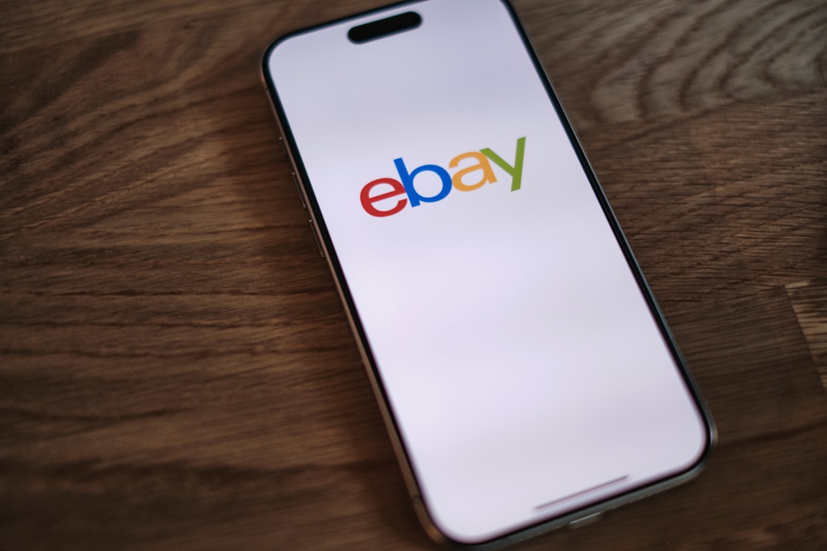 A close up of a cell phone on a table related to Elevate Your Home Decor with eBay's Exquisite Sideboards and Buffets