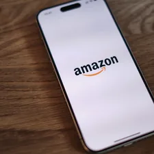 A close up of a cell phone on a table related to Exploring the Benefits of the Amazon Platform Bed: A Comprehensive Guide