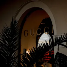 a close up of a clock on the side of a building related to Gucci Bed Set: The Ultimate Luxury for Your Bedroom
