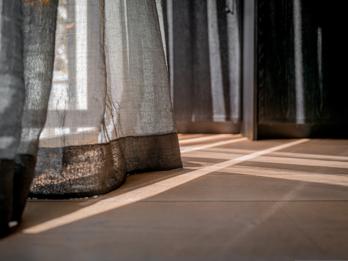 a close up of a curtain on a window sill related to Dress Up Your Curtains: The Ultimate Guide to 2.5 Inch Valance Clips