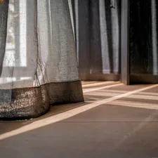 a close up of a curtain on a window sill related to Dress Up Your Curtains: The Ultimate Guide to 2.5 Inch Valance Clips