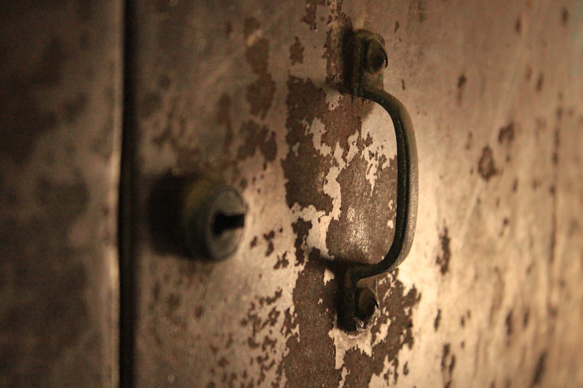 a close up of a door handle related to Industrial Elegance: Reviving Vintage Metal in Modern Sideboards