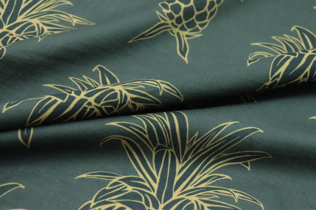 a close up of a green fabric with a pattern of palm trees related to Tropical Bedspreads & Coverlets