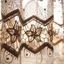 a close up of a lace curtain with a window in the background related to Valance Curtain Patterns