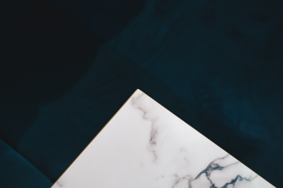 a close up of a marble table top related to Elevate Your Home with Majestic Marble Top Sideboards