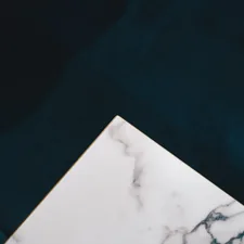 a close up of a marble table top related to Elevate Your Home with Majestic Marble Top Sideboards