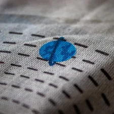 a close up of a piece of cloth with a design on it related to Create a Cozy Ocean-Themed Bedroom