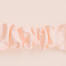 a close up of a pink curtain on a wall related to Warm and welcoming: Pink valance curtains