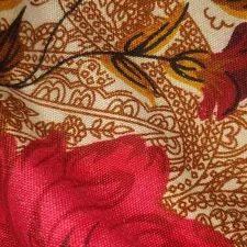 a close up of a red flower on a fabric related to Transform Your Bedroom with Exquisite Indian Print Bedding