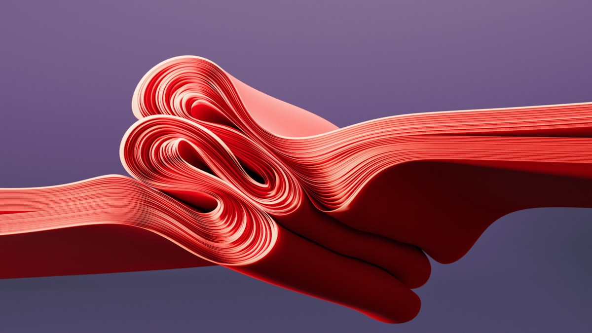 A close up of a red ribbon on a purple background related to Red Coverlet Twin: A Comprehensive Guide