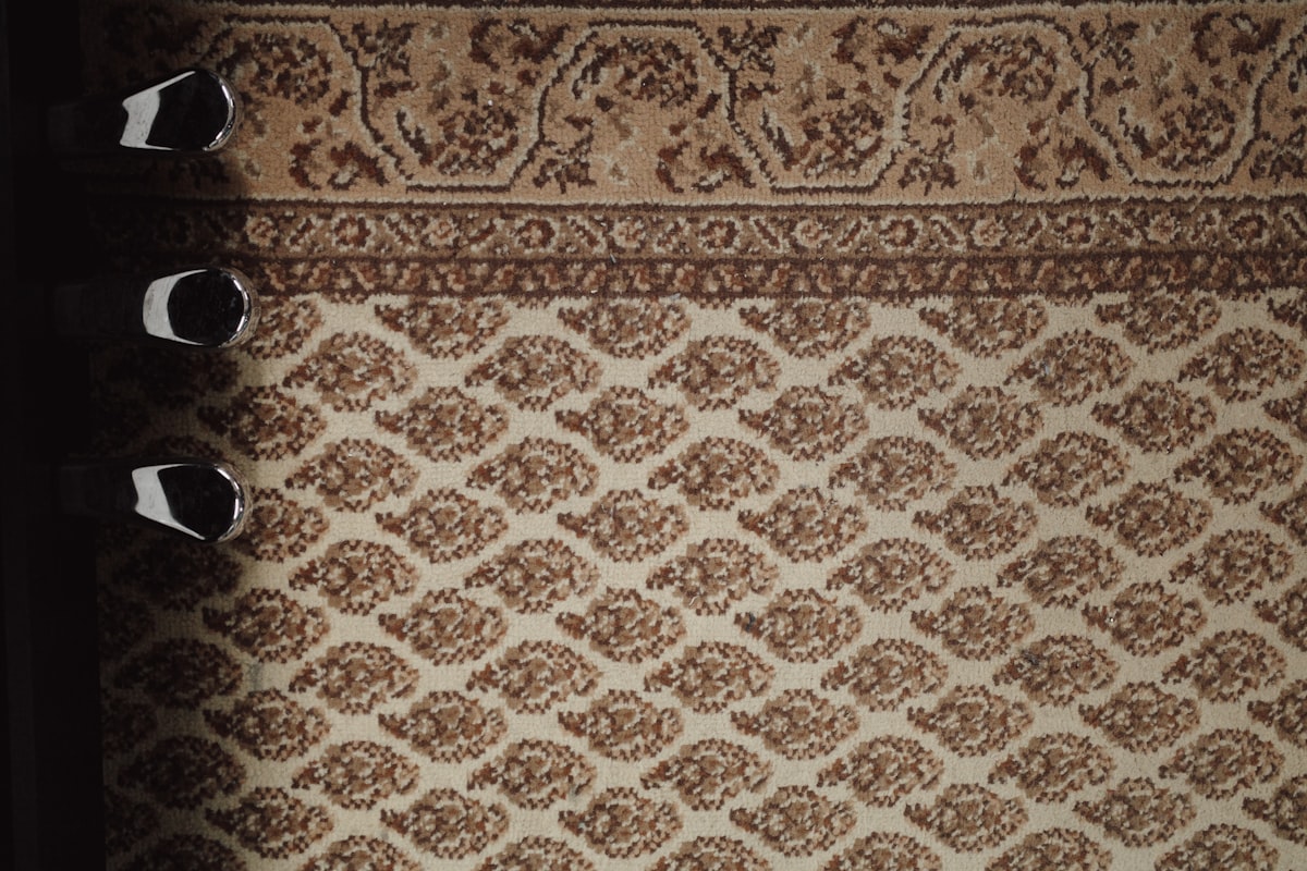 a close up of a rug with a pair of shoes on it related to Curtain Valence Patterns
