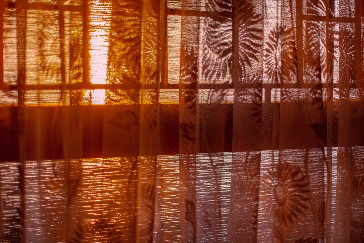 a close up of a sheer curtain with leaves on it related to Brown Sheer Valance