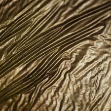 a close up of a white fabric related to Gold Bed Skirt: Elevate Your Bedroom with Luxury and Elegance
