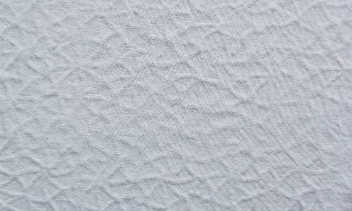 a close up of a white textured wall related to White Quilted Coverlet