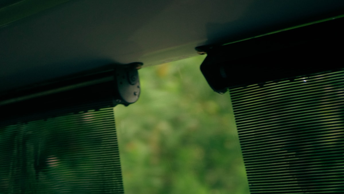 a close up of a window with a blind related to Vertical Blind Valance Clips - Enhance Your Window Treatment