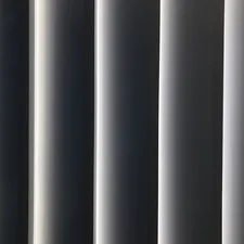 a close up of a window with vertical blinds related to Gray and White Valance: A Comprehensive Guide