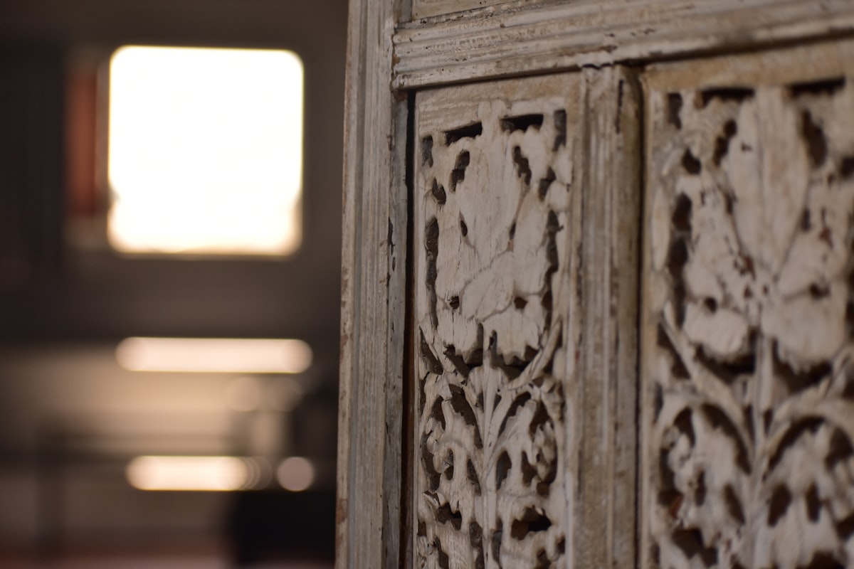 A close up of a wooden door with a window in the background related to 10 Unique White Distressed Sideboard Ideas to Elevate Your Home Decor