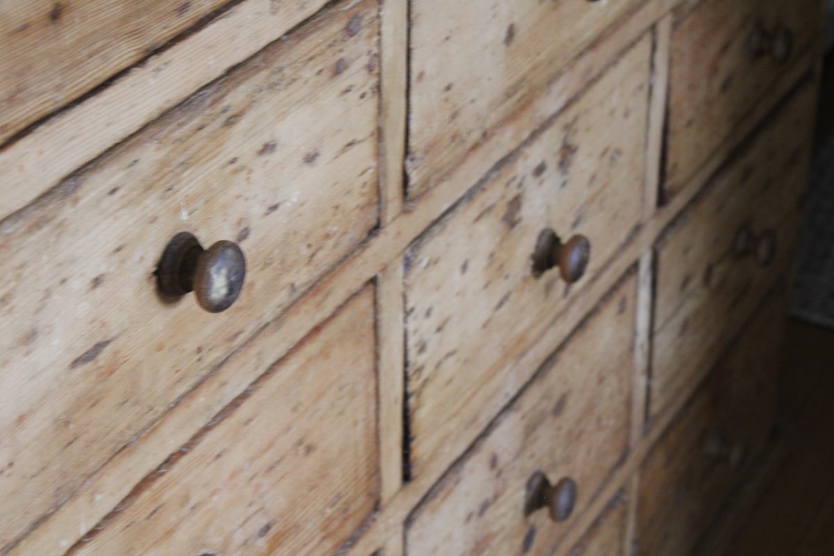 a close up of a wooden dresser with knobs related to Rustic Charm for Any Dining Space