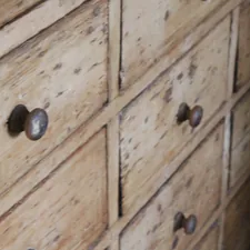 a close up of a wooden dresser with knobs related to Rustic Charm for Any Dining Space
