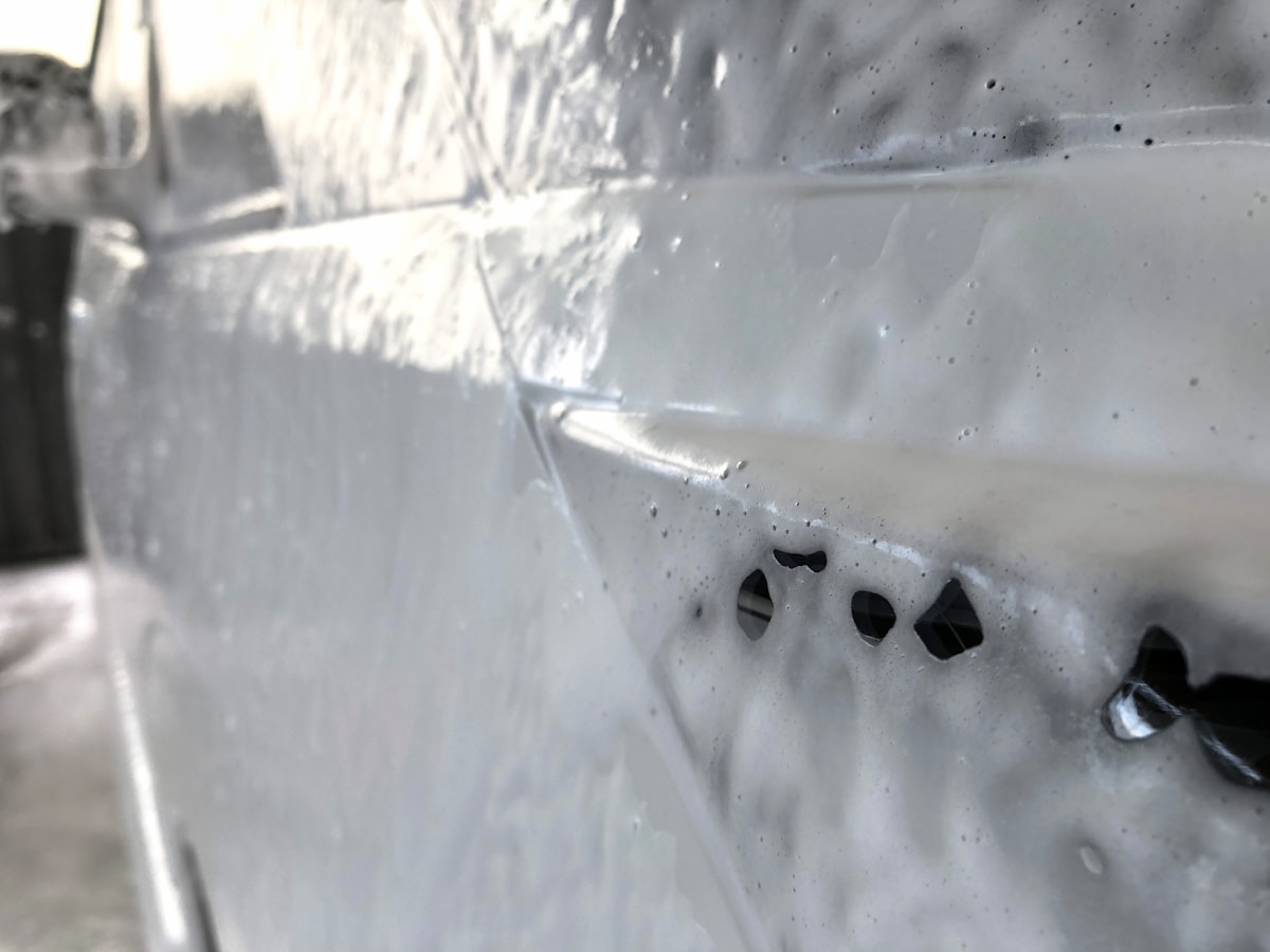a close up of the side of a car with snow on it related to Spray Bed Liner Cost: A Comprehensive Guide to Saving Money