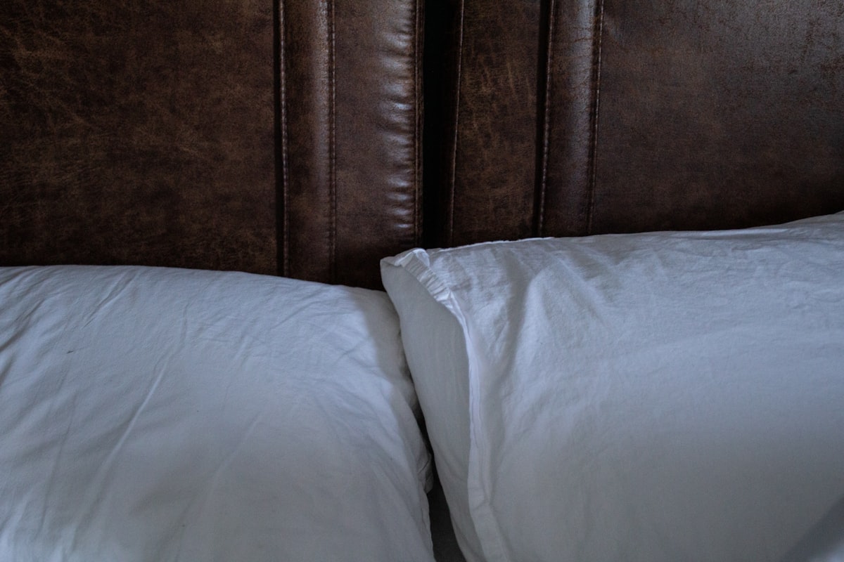 a close up of two pillows on a bed related to The Ultimate Guide to Bed Wrap Valances