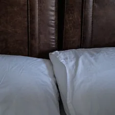 a close up of two pillows on a bed related to The Ultimate Guide to Bed Wrap Valances