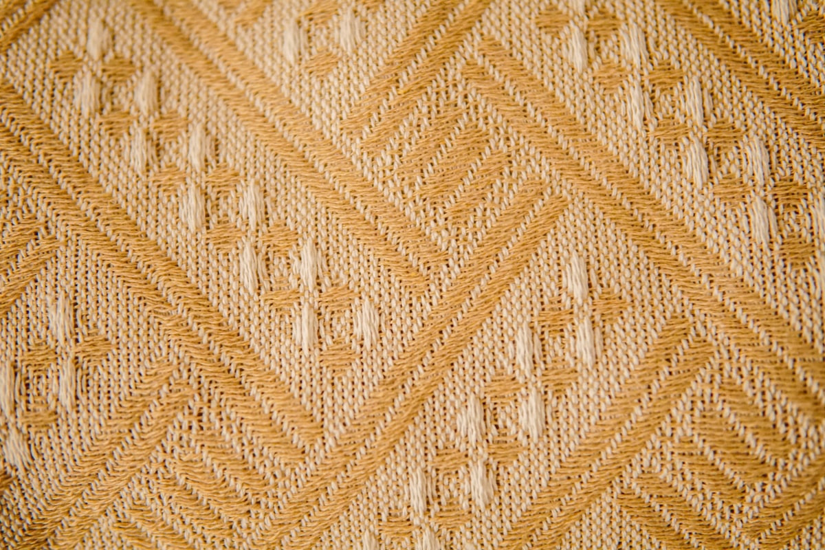 a close up view of a knitted blanket related to Antique Woven Coverlets