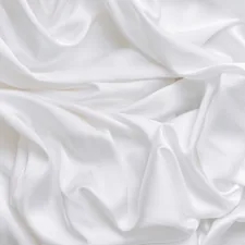 a close up view of a white fabric related to Luxurious Silk Coverlets for Queen-Sized Beds
