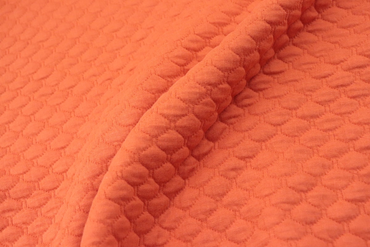 a close up view of an orange blanket related to Twin Matelasse Coverlet Sale | Discounted Prices